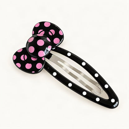 Curved pink and black spotted acetate hair clip, front view [FITINY Hair]