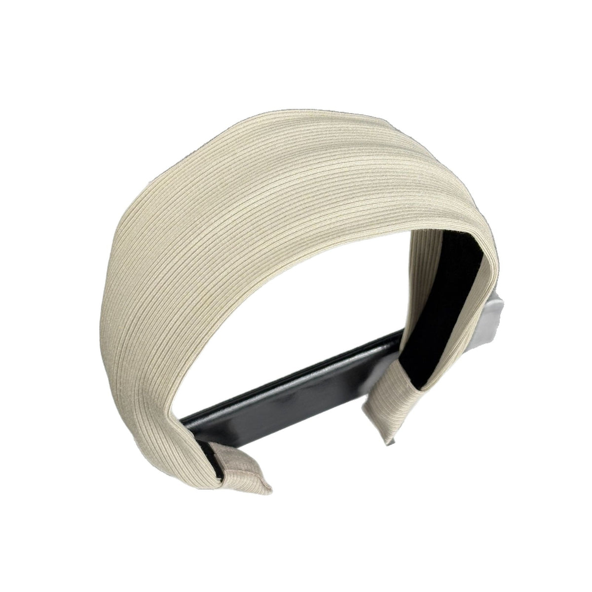 Cream ribbed headband showing its toothed inner lining