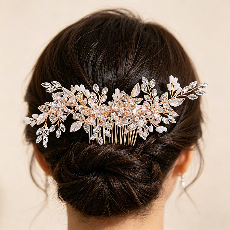 Floral bridal hair comb worn in a dark updo