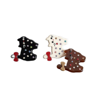 Black, white, and amber cat-shaped acetate hair clips with colorful rhinestones and bow details