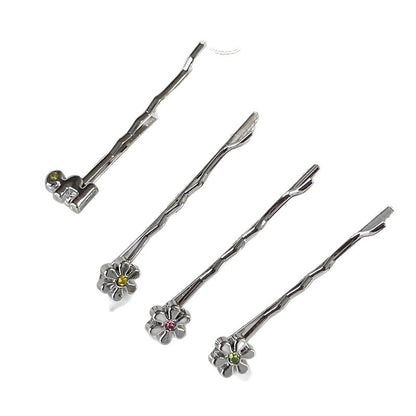 Four silver metal bobby pins with decorative flower and colored rhinestone accents