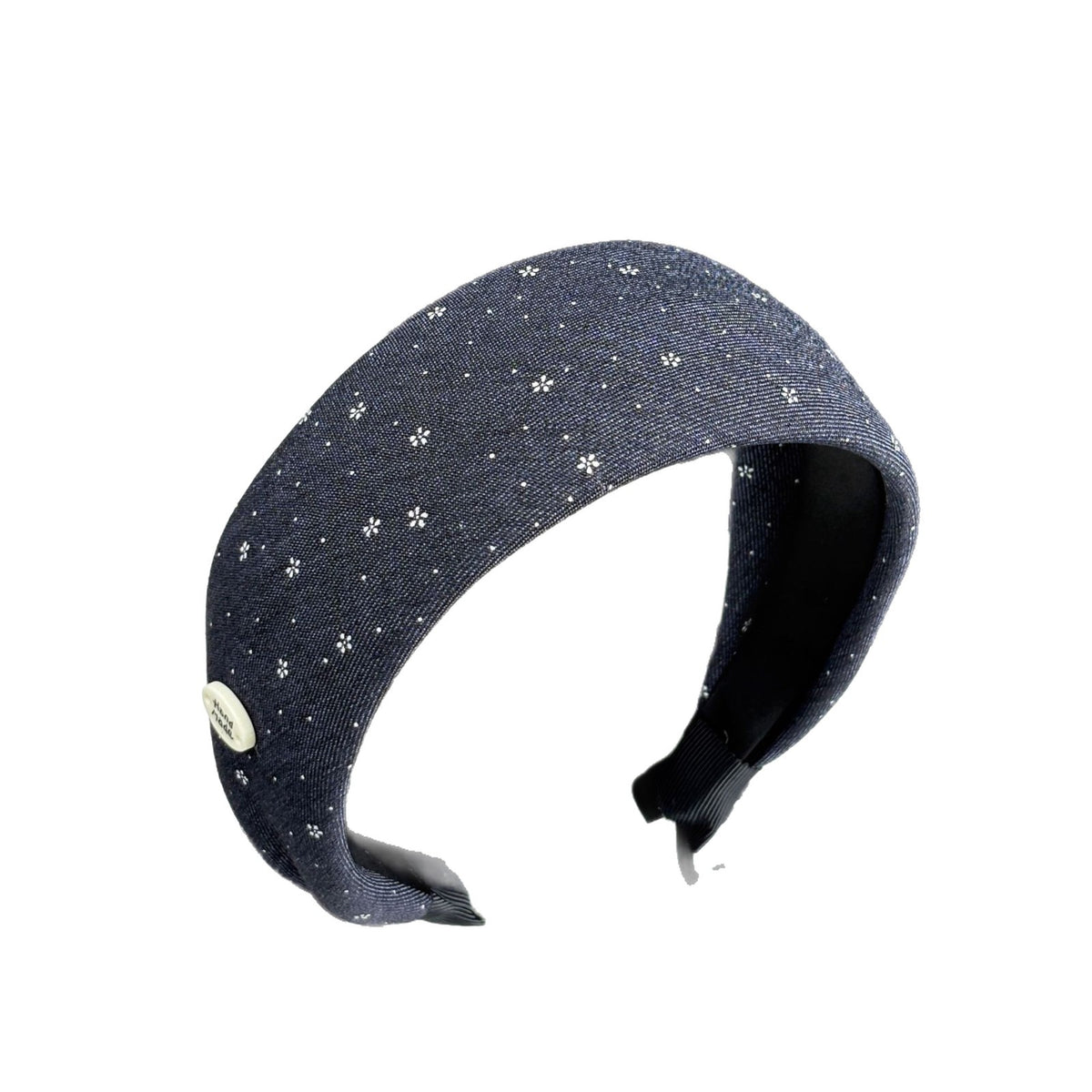 Navy wide floral headband isolated against a white background
