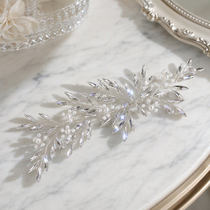 Angled view of the leaf-shaped rhinestone hair vine