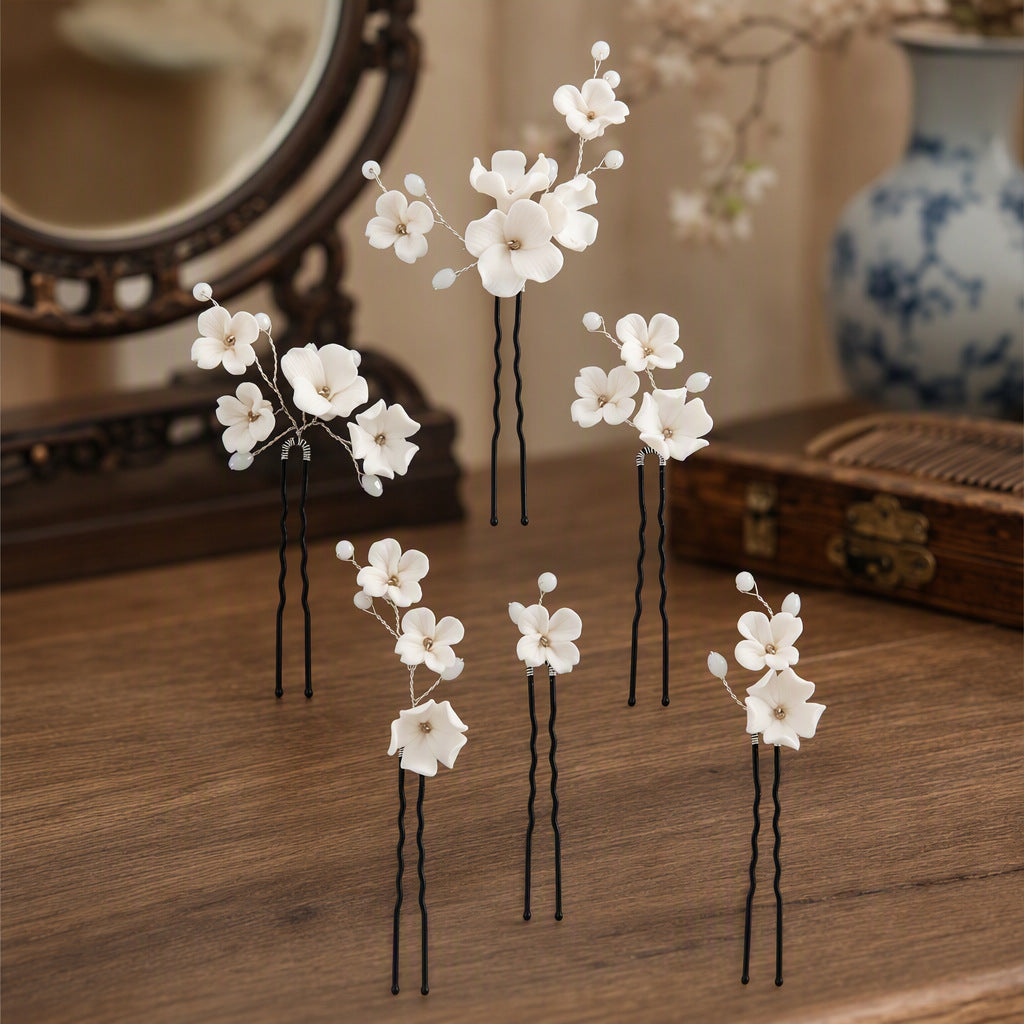 Set of black U pins with ceramic flowers and crystal accents