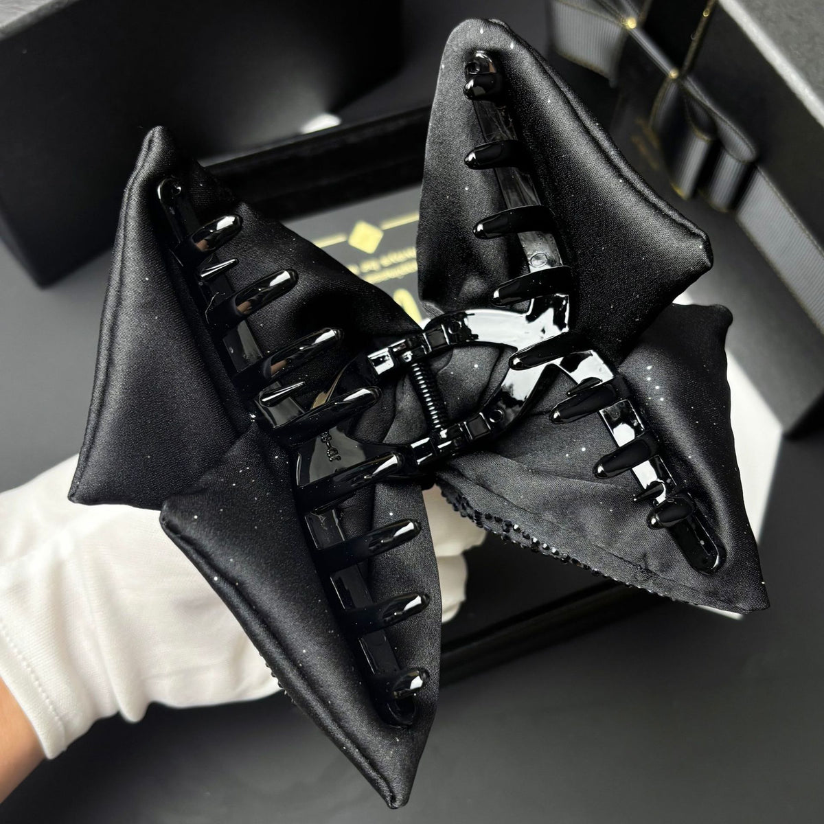 Back view showing the teeth and spring of the black claw clip