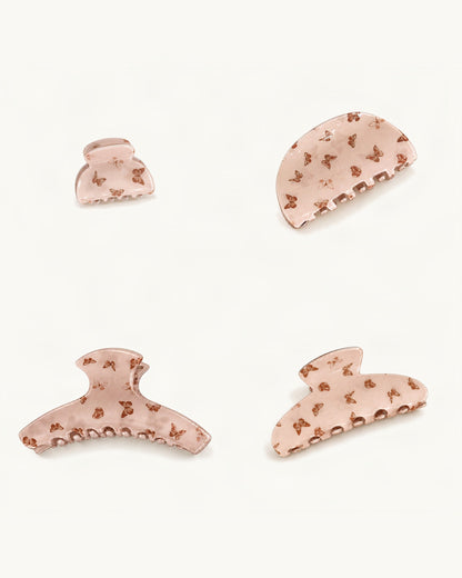 Butterfly Print Acrylic Claw Clip Set of 4 — Latte set of four claw clips on a warm ivory background [FITINY Hair]