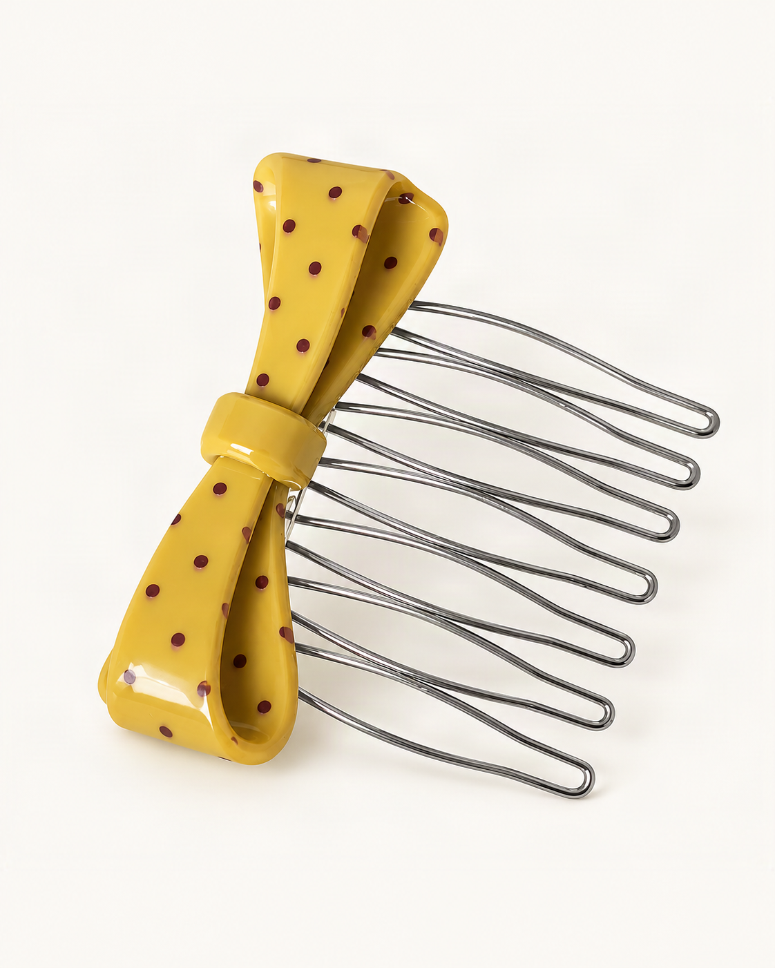 Cellulose Acetate Polka Dot Bow Comb — single accessory on warm ivory background [FITINY Hair]