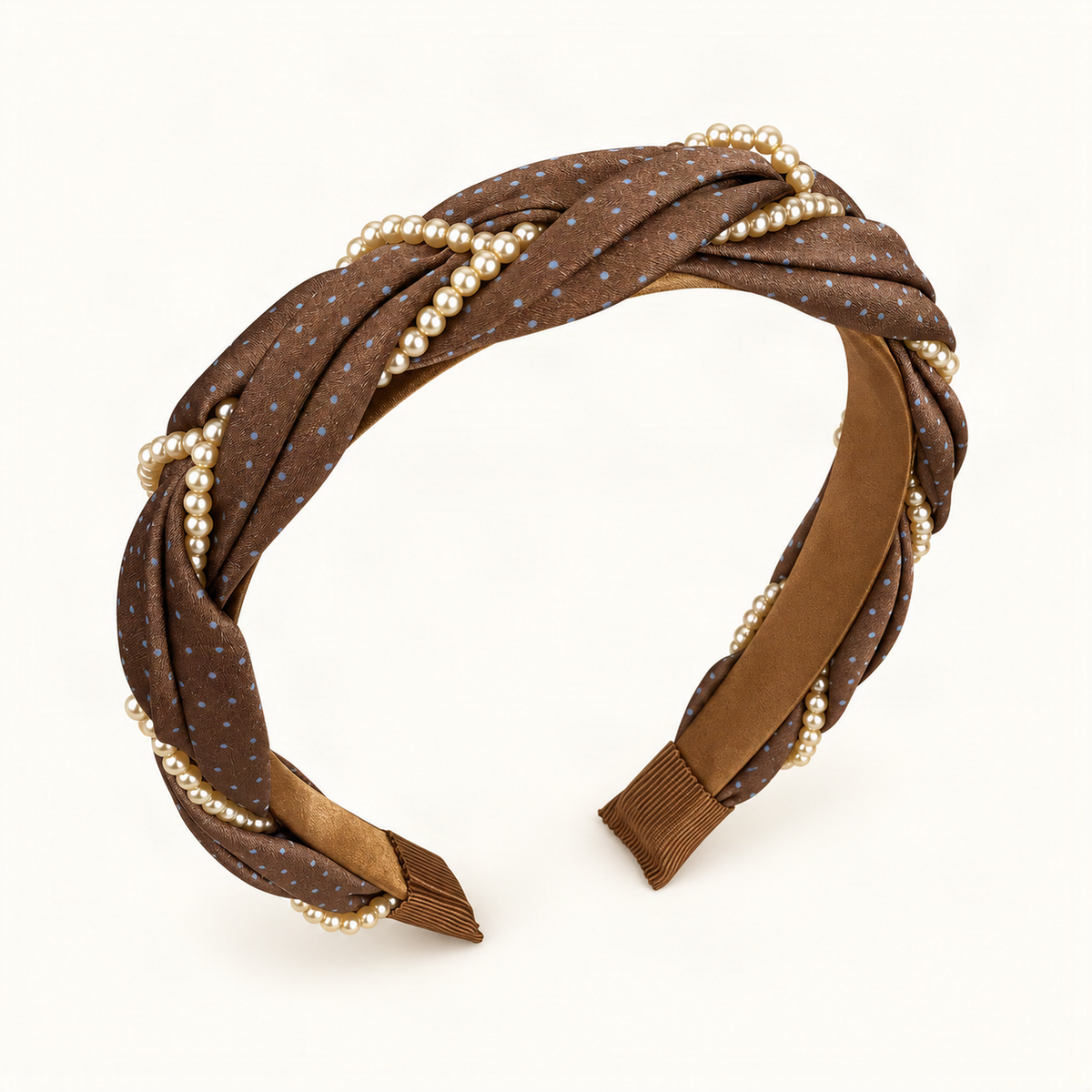Chocolate polka dot satin headband with pearl beading, top angle on warm ivory [FITINY Hair]
