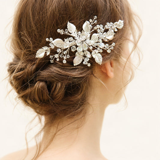 Silver crystal leaf bridal clip worn above a low twisted bun, rear detail [FITINY Hair]