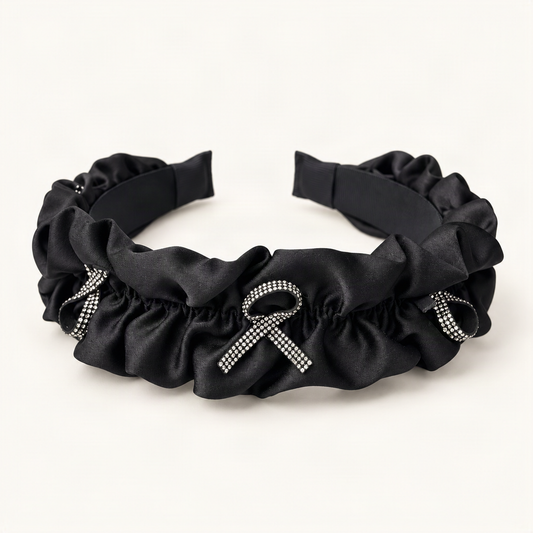 Rhinestone Bow Satin Padded Headband with Ruffled Trim — black ruffled satin headband, frontal angle [FITINY Hair]