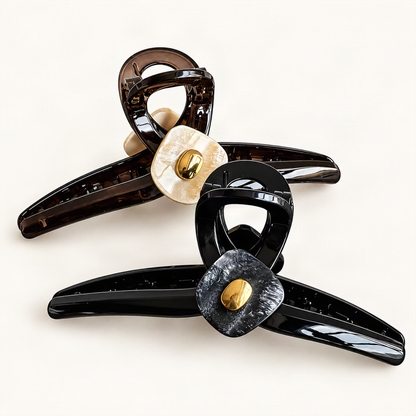 Black and Champagne & Chocolate acrylic claw clips together on warm ivory [FITINY Hair]