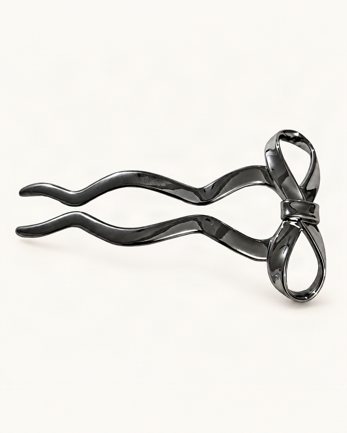 Metal U-Shaped Hair Fork with Decorative Top — Gunmetal / Bow variant on warm ivory background [FITINY Hair]